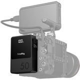 SmallRig power bank attached to a camera on a white background