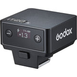 Black Godox camera flash controller with digital display on a white background