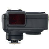 Black camera lens hood with a red filter on a white background