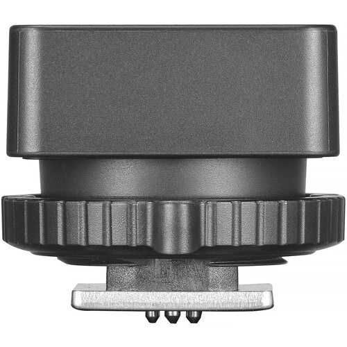 Black camera lens cap with a silver base on a white background