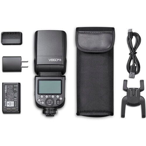 Camera flash unit with accessories on a white background