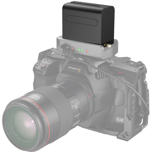 Camera with a battery pack on a white background