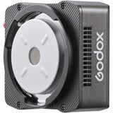 Godox camera flash unit with a white lens on a gray background