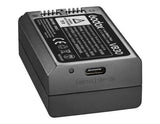 A Godox VB30 rechargeable camera battery shown from a three-quarters angle, featuring a matte dark gray body, a USB-C port, and a detailed specification label on top.