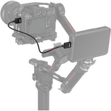Video camera with monitor and accessories on a white background