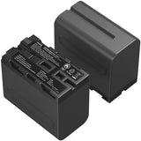 Black battery and charger on a white background
