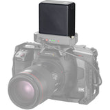 Camera with a mounted battery pack on a white background