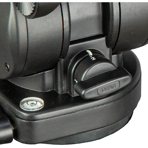 Close-up of a black camera tripod base with a dial labeled DRAG and a silver adjustment screw on a white background.