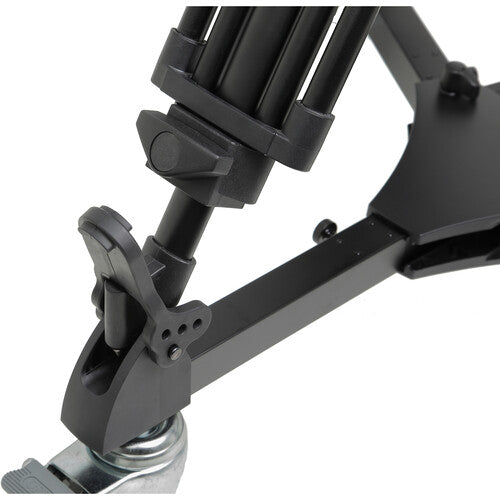 Black adjustable tripod stand on a white background