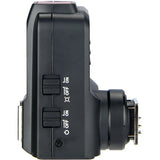 Black electronic device with control buttons on a white background