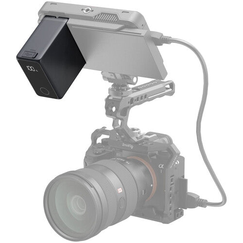 Camera with a monitor attached on a white background