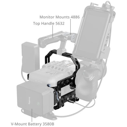 A monochrome technical diagram showing a camera handle rig with labeled callouts: Monitor Mounts 4886, Top Handle 5632, V-Mount Battery 3580B, and a small brand mark near the top that appears to read IJIX.