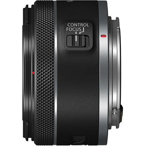 Camera lens with control focus button on a white background