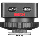 Camera lens control unit with '+' and '-' buttons and 'X5C' branding on a white background