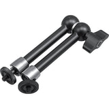 Black and silver camera tripod on a white background