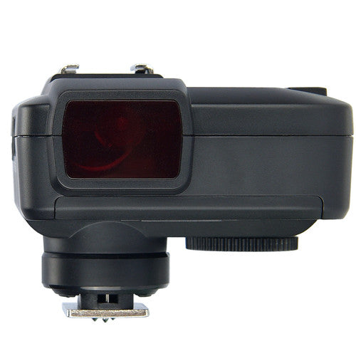 Black camera lens hood with a red filter on a white background