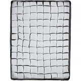Grid-patterned mat with black and white squares on a white background