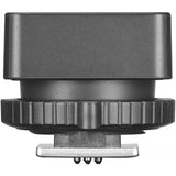 Black camera lens cap with a silver base on a white background