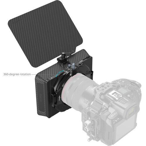 Camera with a lens hood and 360-degree rotation feature on a white background