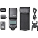 Camera flash unit with accessories on a white background