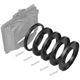 Five black camera lens filter rings arranged in a staggered row, with size labels below each ring reading 95-86mm, 95-62mm, 95-58mm, 95-55mm, and 95-52mm. A faint gray camera body outline appears behind the rings on a white background.