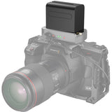 Camera with a battery pack on a white background