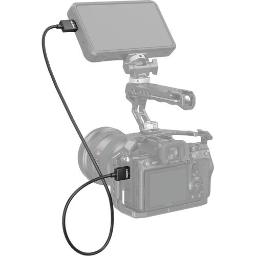 Camera with a microphone and monitor on a white background