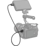 Camera with a microphone and monitor on a white background