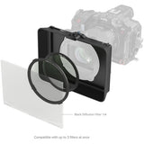 Camera lens with black diffusion filter and additional filter holder on a white background