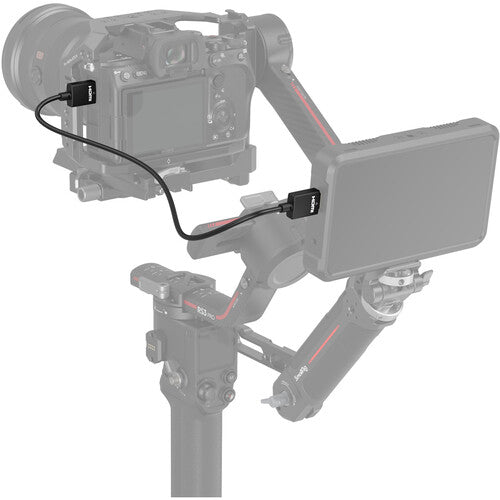 Video camera with monitor and accessories on a white background
