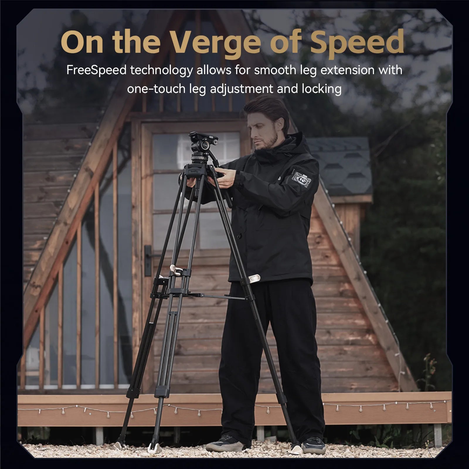 A man in a black jacket and pants stands behind a tripod in front of a wooden A-frame cabin, with promotional text at the top reading 'On the Verge of Speed' and a description of smooth leg extension and one-touch leg adjustment.