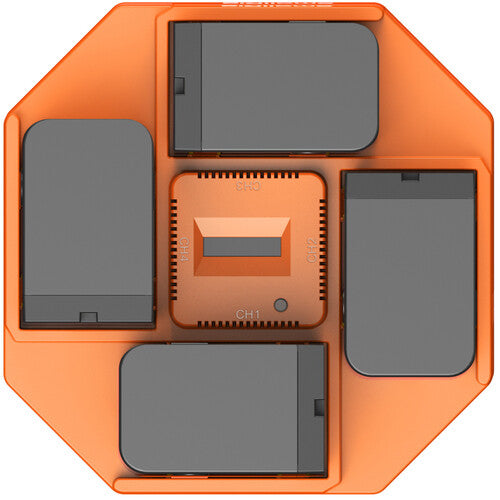 An orange octagonal electronic device with four dark gray rectangular panels arranged around a central orange module, shown from a top-down view on a white background.