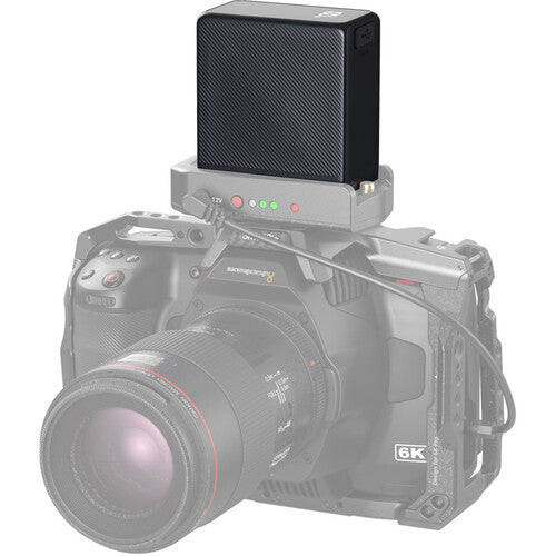 Camera with a mounted battery pack on a white background