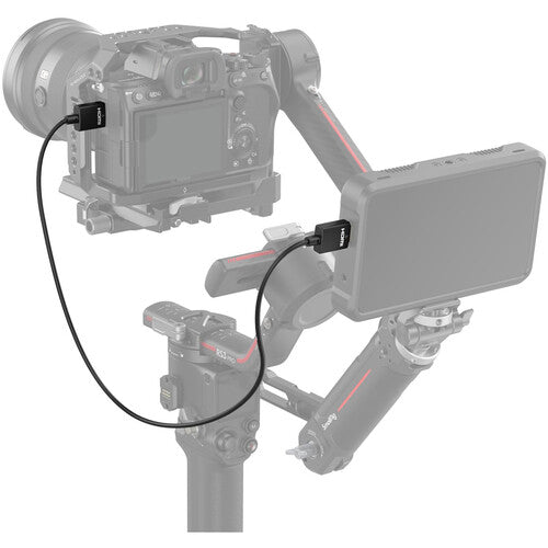 Camera setup with a monitor and control device on a white background