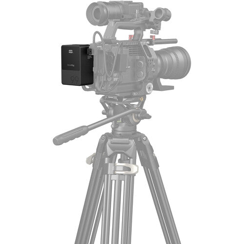 Video camera on a tripod with a white background