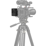 Video camera on a tripod with a white background