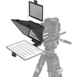 Camera on a tripod with various accessories including a screen and a modular panel.