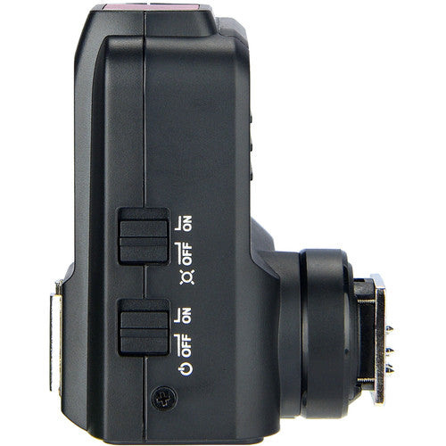 Black electronic device with control buttons on a white background