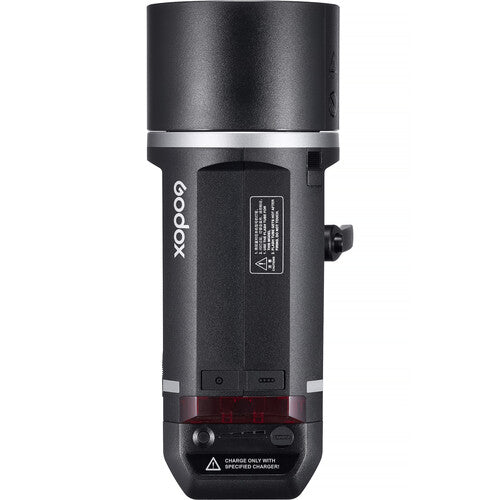 Black Godox camera flash on a white background