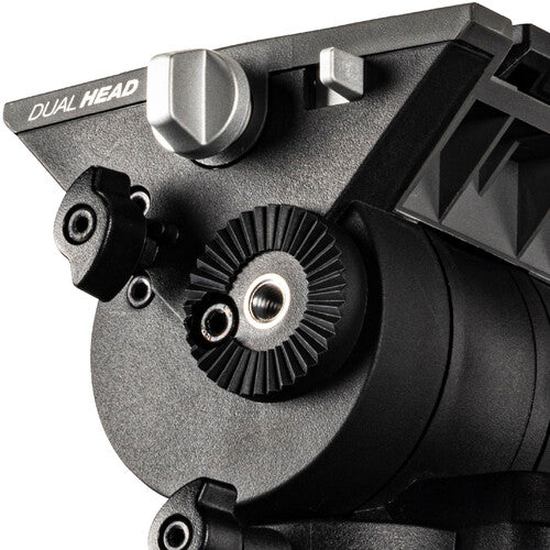 Close-up of a black dual-head tripod head with silver adjustment knobs and the text 'DUAL HEAD' printed on the side, shown against a white background.