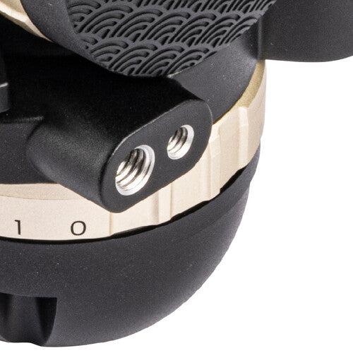 Close-up of a microphone with a black and beige design on a white background