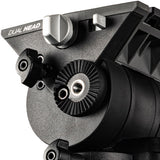 Close-up of a black dual-head tripod head with silver adjustment knobs and the text 'DUAL HEAD' printed on the side, shown against a white background.