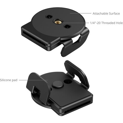 Black quick-release camera mount shown from two angles on a white background, with labeled callouts for the attachable surface, 1/4"-20 threaded hole, and silicone pad.